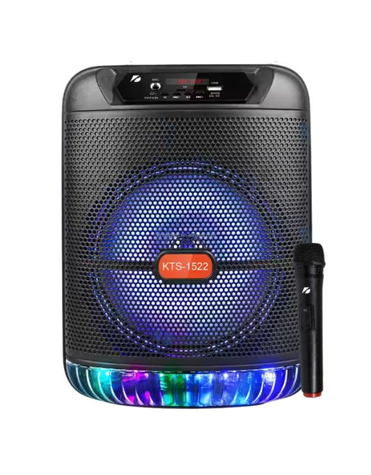 An image of a black portable wireless Bluetooth speaker with a blue light around the speaker area and a microphone in hand showing the product's scale.