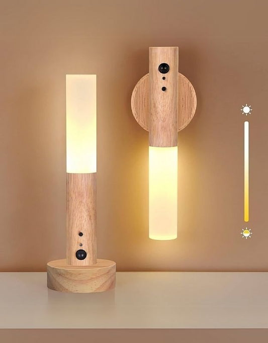 Two cylindrical sensor lamps with wooden bases, one standing upright and the other lying on its side, illuminated, showcasing different lighting intensities and a motion sensor in action with a graphical representation of the sensor range.