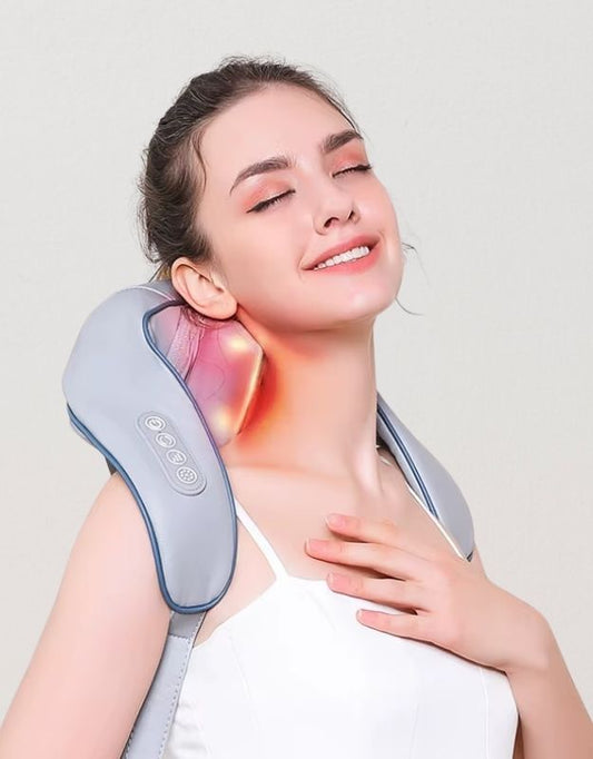 A person is seen using a neck and shoulder massager with a heat simulator, enjoying the relaxation.