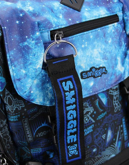 Close-up of the Smiggle blue space backpack and danger keychain.