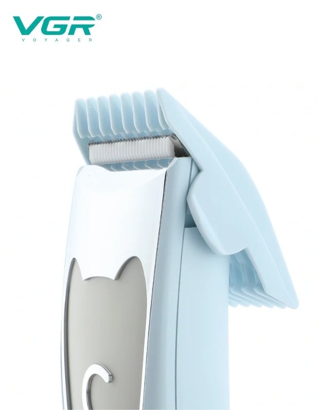 Blue electric grooming tool on a white background. Close-up of VGR V-203 pet grooming clipper with guide comb attached.