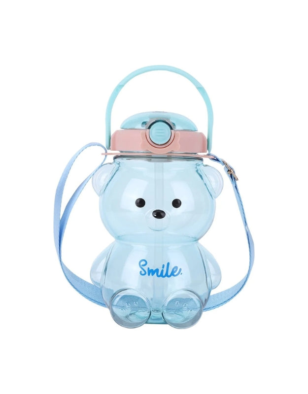 Light blue bear-shaped water bottle with pink lid, blue straw, and a matching blue shoulder strap. The word "Smile" is written on the front.