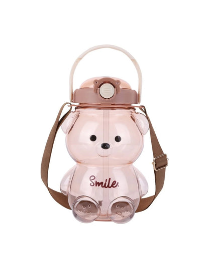 Light brown bear-shaped water bottle with brown strap and brown lid. The word "Smile" is written on the front in brown text.