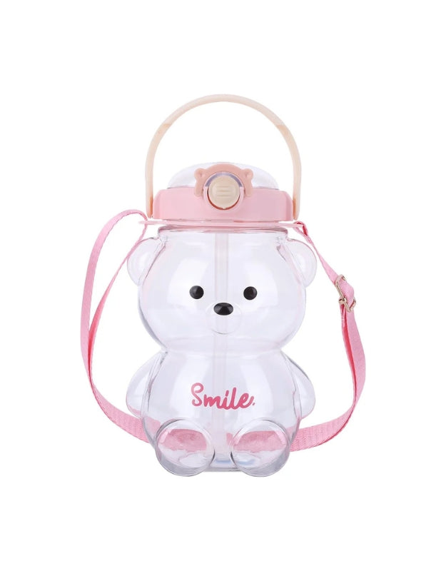 Clear bear-shaped water bottle with pink lid and pink shoulder strap. The word "Smile" is written in pink on the front.