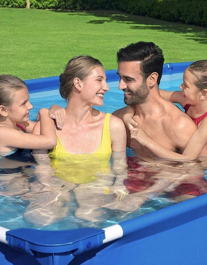Parents with two children smiling and bonding inside the Bestway 56405 Steel Pro pool