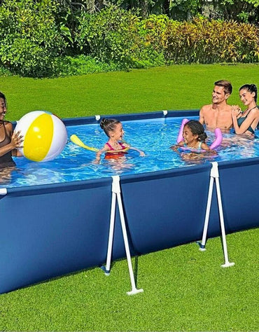 Family enjoying the Bestway 56405 Steel Pro rectangular frame pool while playing with a beach ball.