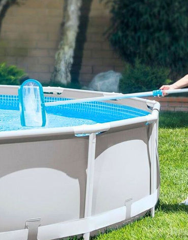 Person using Bestway 58278 bottom landing net to clean a round above-ground pool.