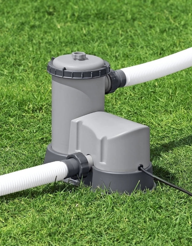 Bestway 58389 Flowclear 5678L/H above ground swimming pool pump on grass with hoses connected