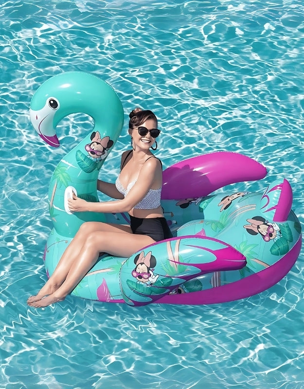 Woman relaxing on Bestway Disney Minnie Mouse flamingo inflatable float in a pool.