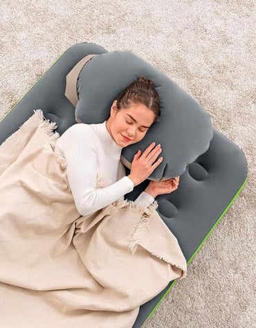 Woman sleeping comfortably on Bestway inflatable air bed with pillow.
