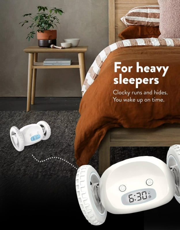 Clocky alarm clock running on floor beside bed – perfect for heavy sleepers