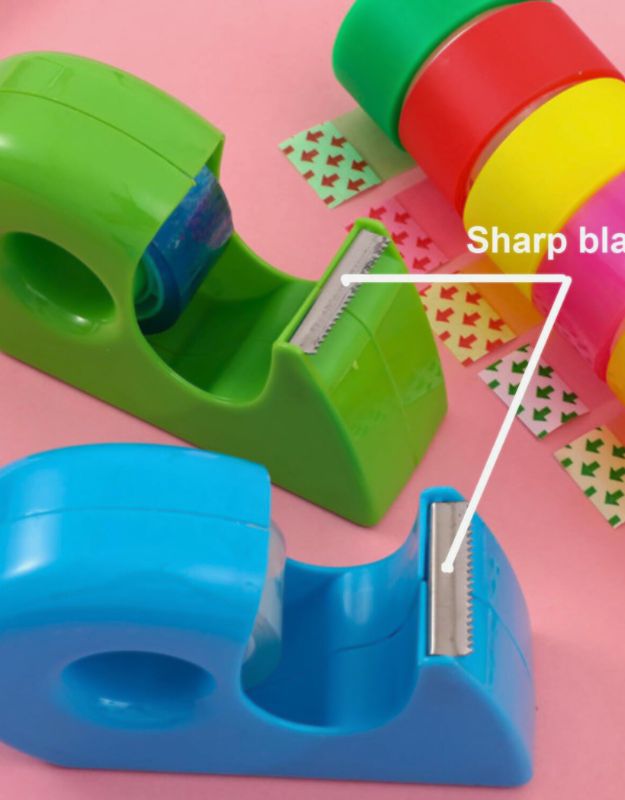 Close-up of blue and green tape dispensers showing sharp blades, with colorful tapes and arrow stickers.