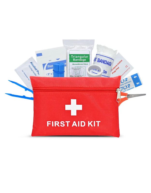 A red first aid kit with a white cross sign on the front, containing various medical tools, including bandages and antiseptic wipes.