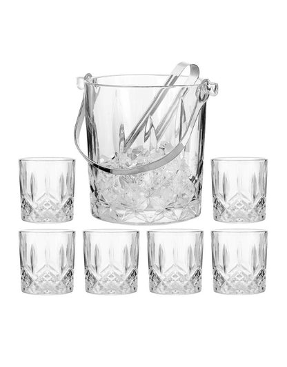 Crystal glass ice bucket with a metal handle and tongs, filled with ice cubes
