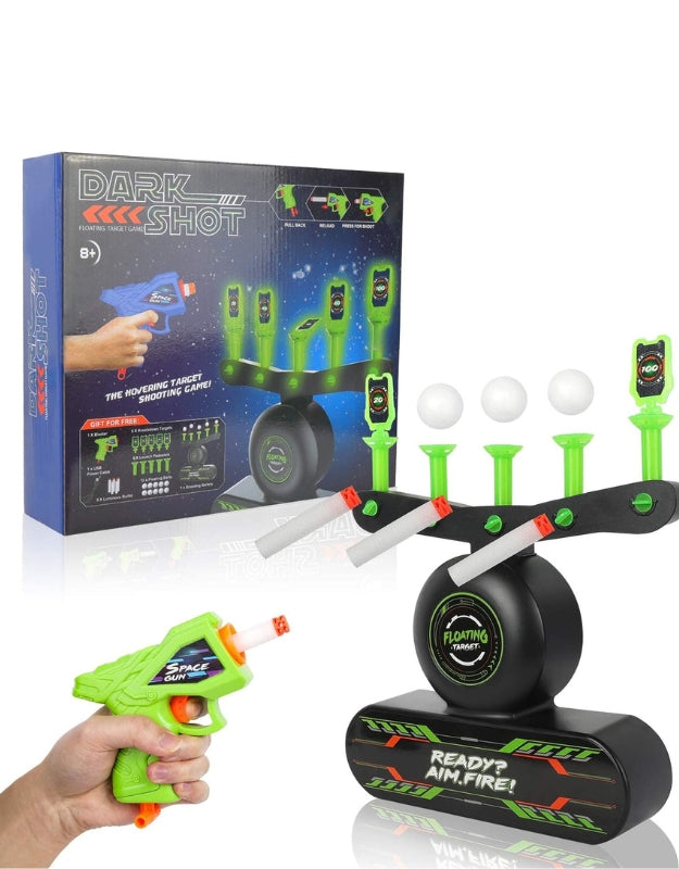 Close-up of the dark shooting target and glowing foam balls.