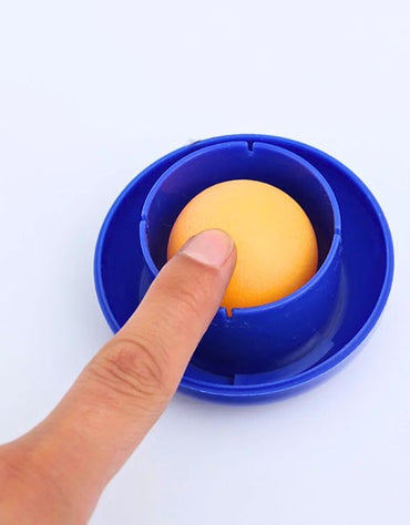 Close-up of a hand pressing the yellow sponge in the blue Dingl fingertip moistener cup.