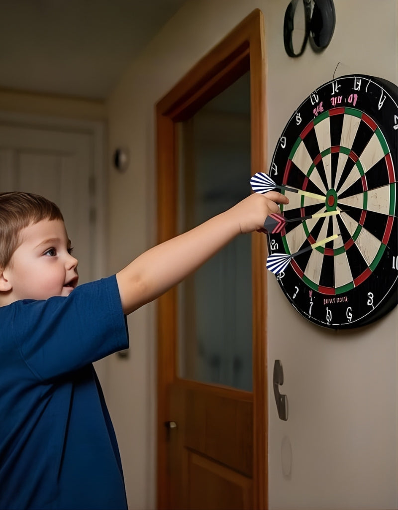 Child playing with a dart board mounted on a wall, aiming darts at the target
