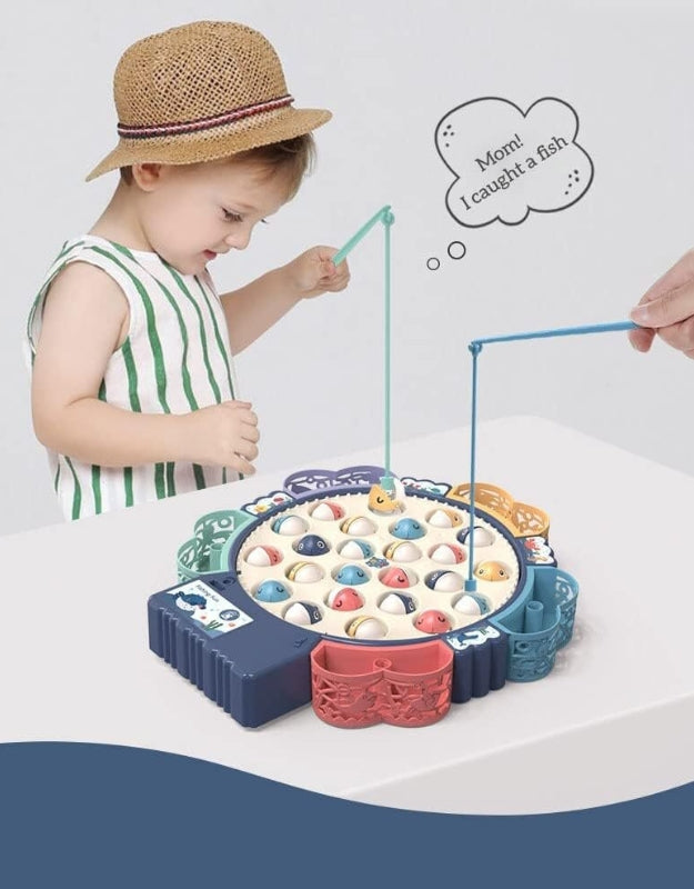 A young child wearing a hat and a striped shirt, smiling while playing the electric fishing game