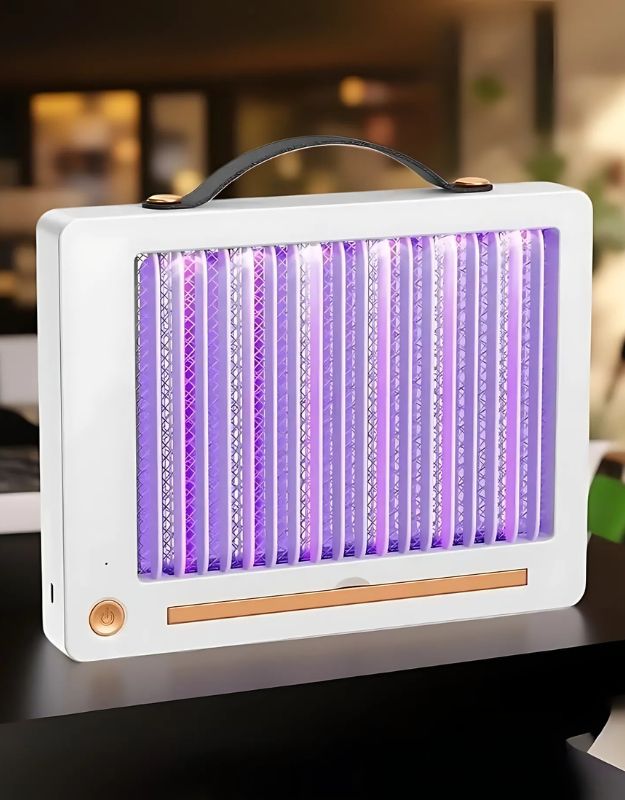 Electric mosquito killer with UV light turned on, a bug zapper in a home setting.