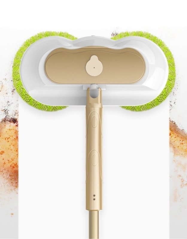 Electric spin mop removing dirt and stains from the floor with dual microfiber pads.