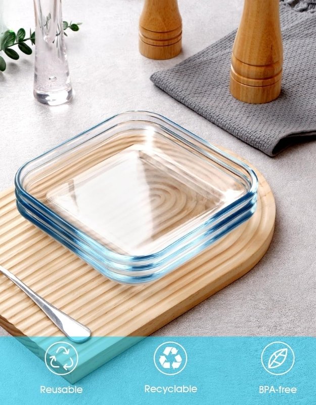 BPA-free, reusable, recyclable glass salad plates stacked on a wooden tray.

