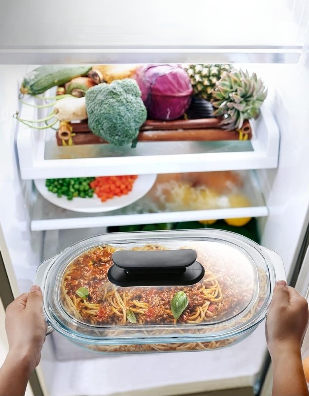 Fenix oval glass baking pan with lid used for storing spaghetti in refrigerator