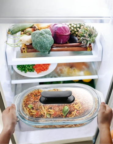 Fenix oval glass baking pan with lid used for storing spaghetti in refrigerator