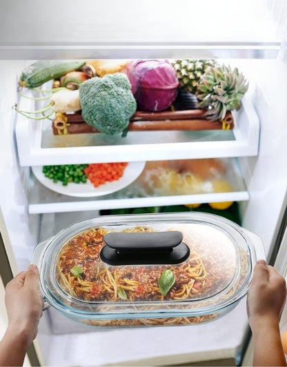 Fenix oval glass baking pan with lid used for storing spaghetti in refrigerator