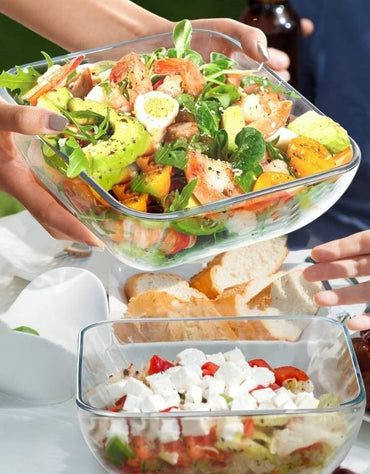 Fenix tempered glass bowls filled with fresh fruit salad and sausages on rice, stackable with lids
