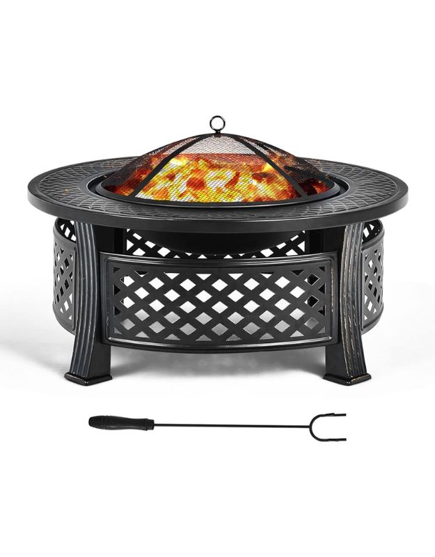 Outdoor fire pit table with mesh cover, showing included poker tool.