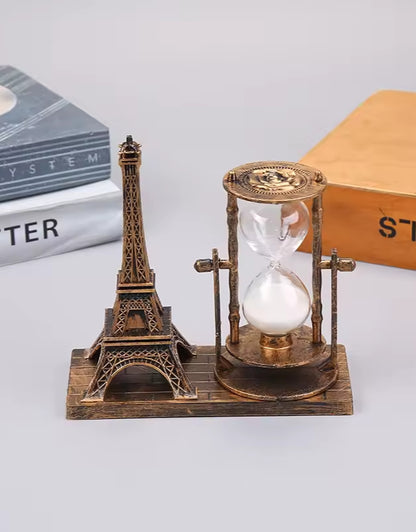Gold Eiffel Tower with Hourglass Timer on Wooden Base – Tabletop with Books