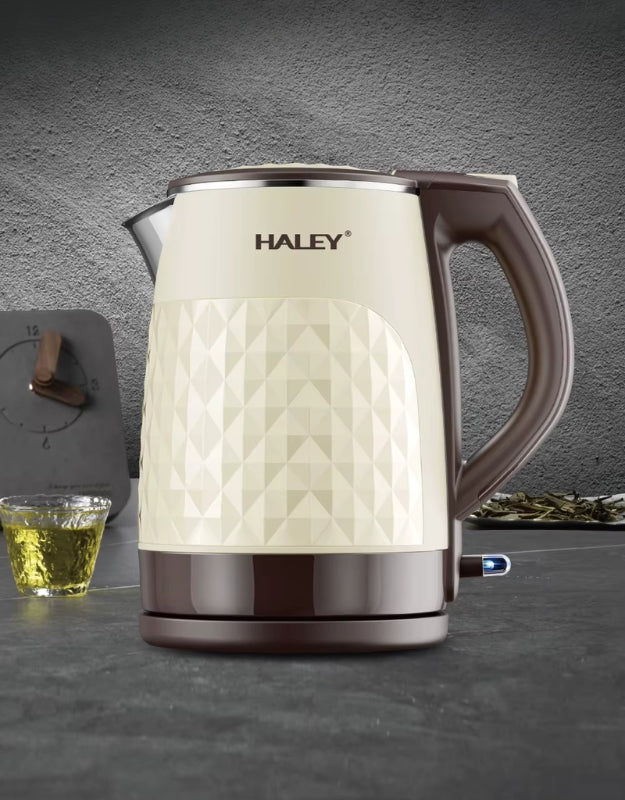 Haley 2.2L double-layer electric kettle displayed on a modern kitchen counter beside a cup of tea