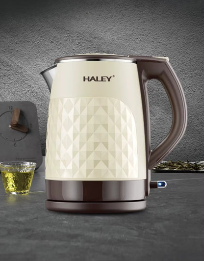 Haley 2.2L double-layer electric kettle displayed on a modern kitchen counter beside a cup of tea