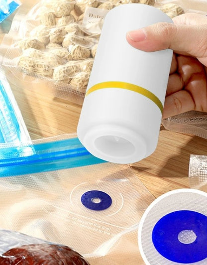 Person using a plastic bottle with a blue straw to dispense a white substance with yellow stripe.