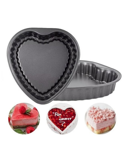 Heart-shaped cake pan with three heart-shaped cakes on a white 
background. Set of heart-shaped nonstick baking pans with sample cakes including strawberry, chocolate, and cream heart cakes.