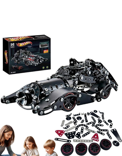 Car model: Assembled car, parts laid out, and people in the corner