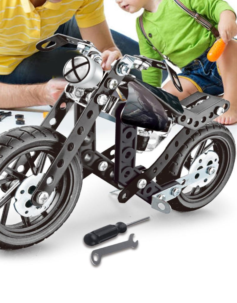 Rear view of the finished HotWheel metal construction set motorcycle, showing the tail