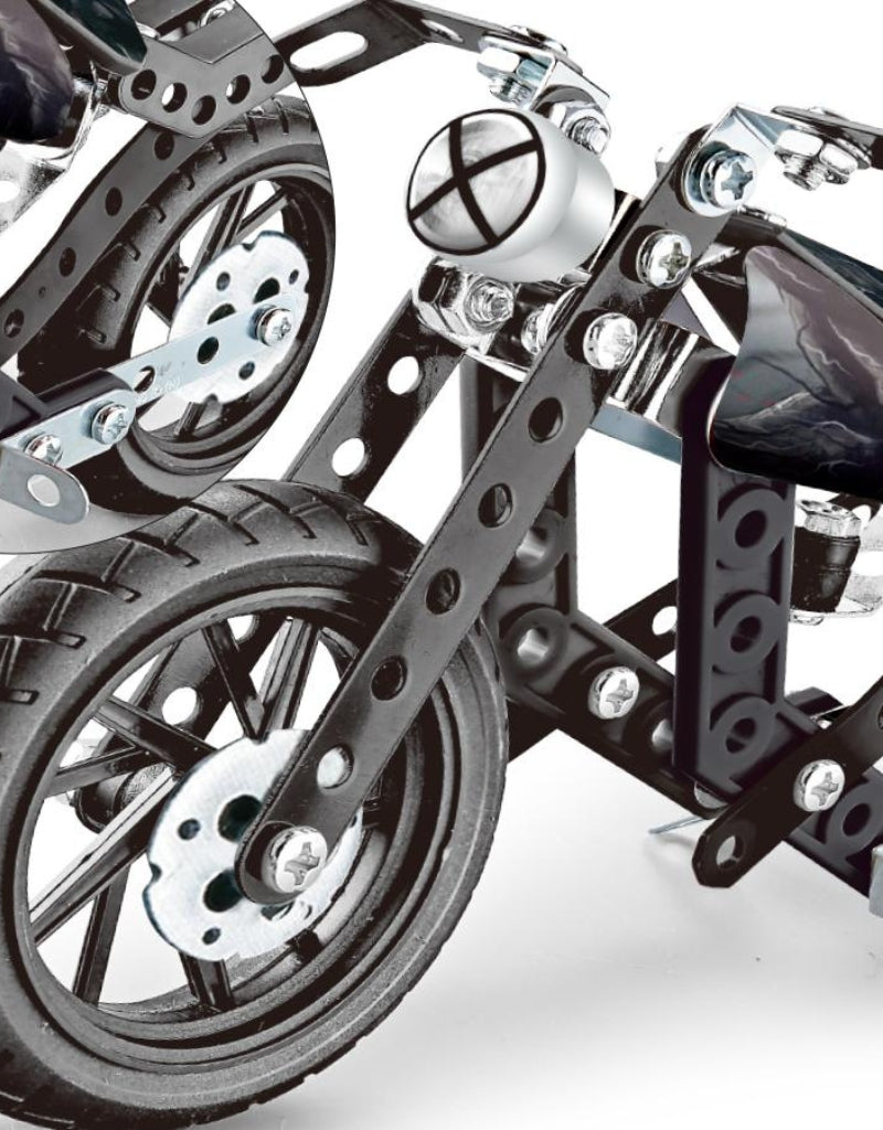 Close-up detail of the front wheel and metal frame of the HotWheel construction motorcycle