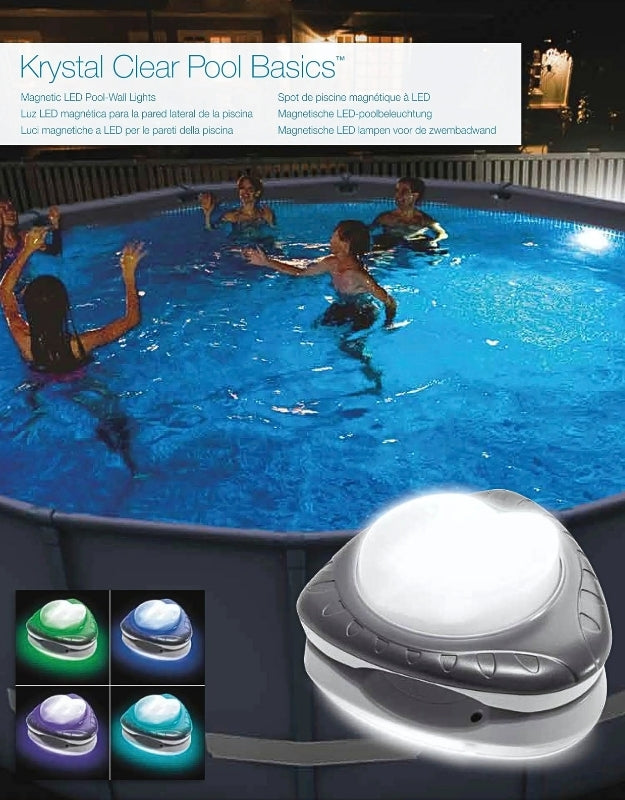 Intex 28688 Magnetic LED Pool Wall Light illuminating a round swimming pool at night, with people swimming and enjoying colorful lighting effects
