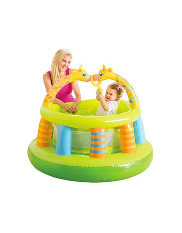 Child playing inside Intex 48474NP Inflatable Mesh Wall Gym with giraffe design while parent supervises.