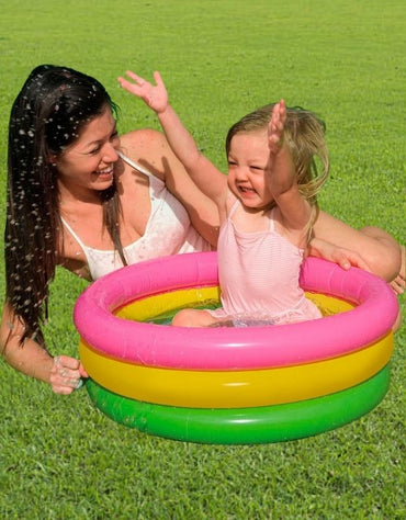 Child playing with her mother in Intex 57107NP multicolor inflatable pool outdoors