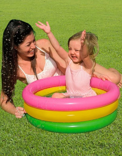 Child playing with her mother in Intex 57107NP multicolor inflatable pool outdoors
