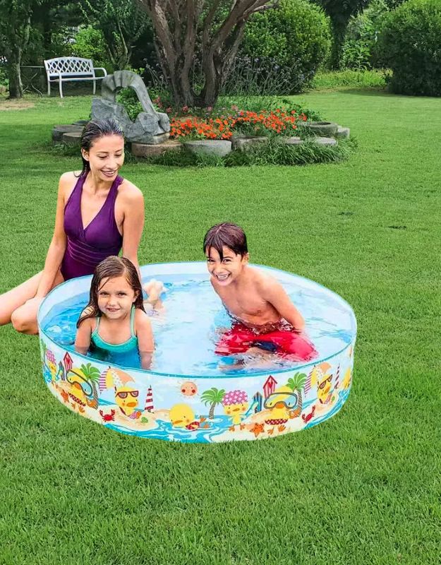 Mother with children playing in Intex 58477NP 122x25cm inflatable circular pool with cartoon duck design in the garden