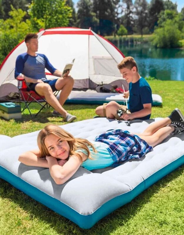 Family enjoying outdoors with Intex 67998 inflatable camping mattress, perfect for tents and outdoor use.