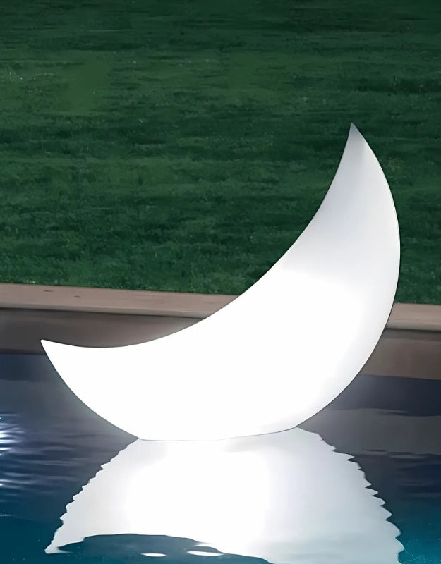 Intex 68693 LED floating crescent light glowing on pool water at night