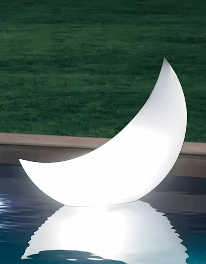Intex 68693 LED floating crescent light glowing on pool water at night