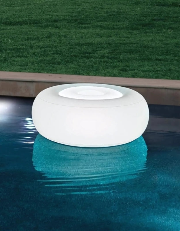Intex 68697 inflatable pouf with LED backlight floating in swimming pool at night