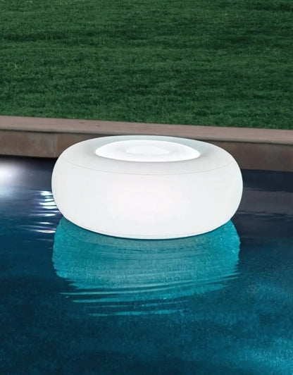 Intex 68697 inflatable pouf with LED backlight floating in swimming pool at night