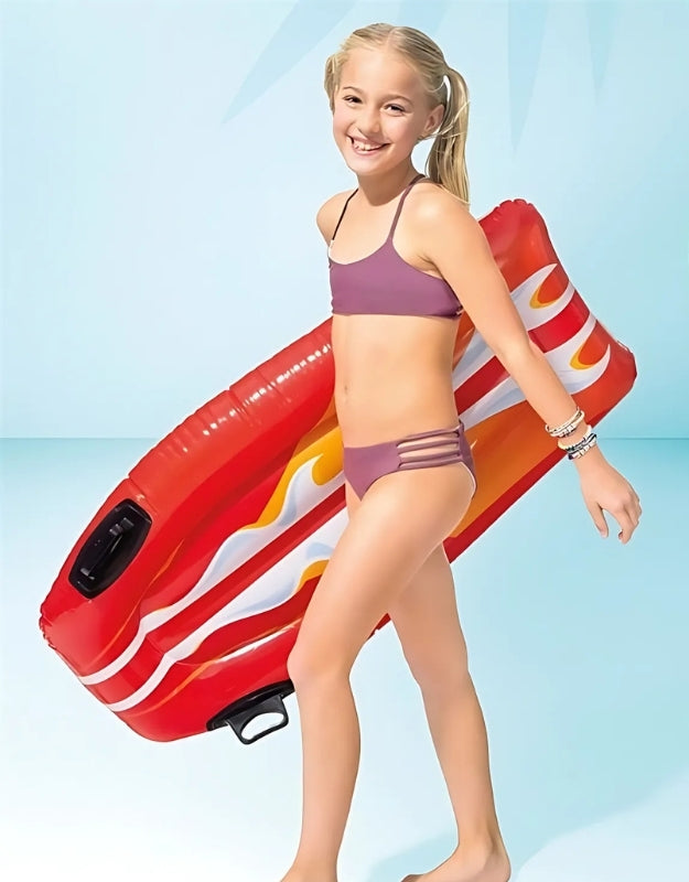 A child enjoying the Intex Joy Rider Surf Board float in a pool.
