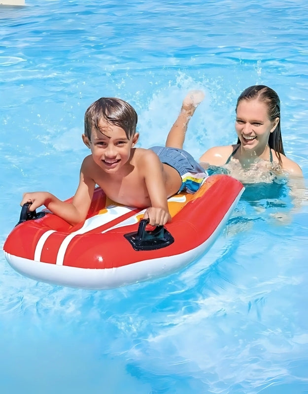 Two kids playing with the inflatable Intex Joy Rider Surf Board in a swimming pool.